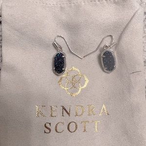 Kendra Scott sterling silver drop earrings with blue/purple tone sparkling stone